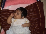 Trying hard to get the finger into the mouth!